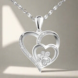 Collar en plata de ley con pata y corazón con circonita
